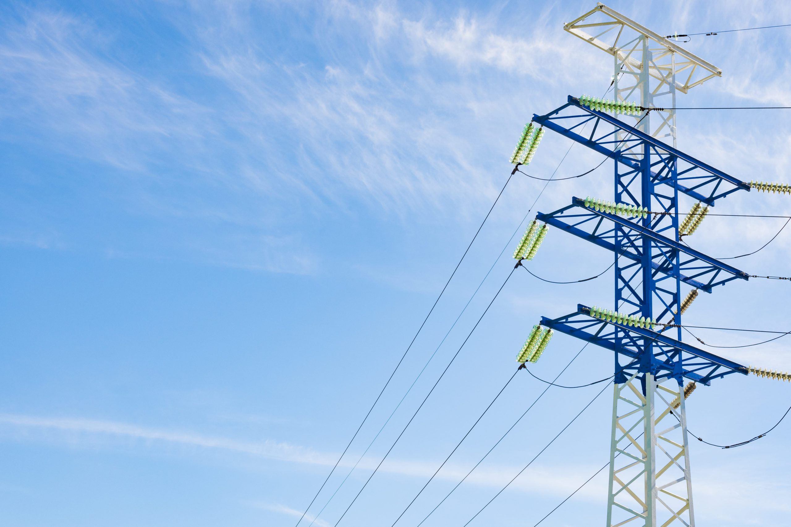 a-high-voltage-electricity-pylons-against-blue-sky-2021-08-26-17-12-33-utc-min